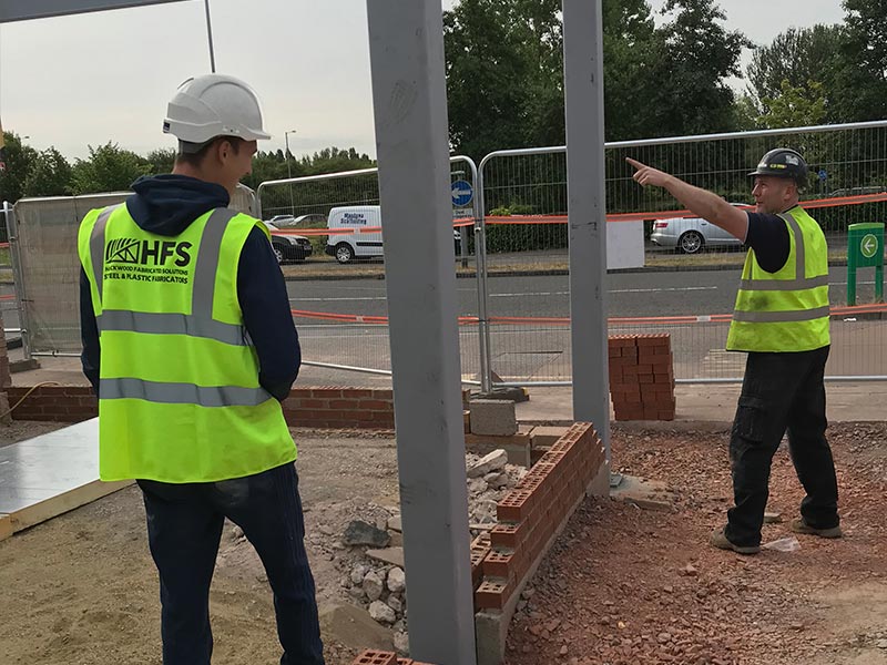 HFS members of staff carrying out an onsite installation which required structual steelwork to be erected for taunton dean services